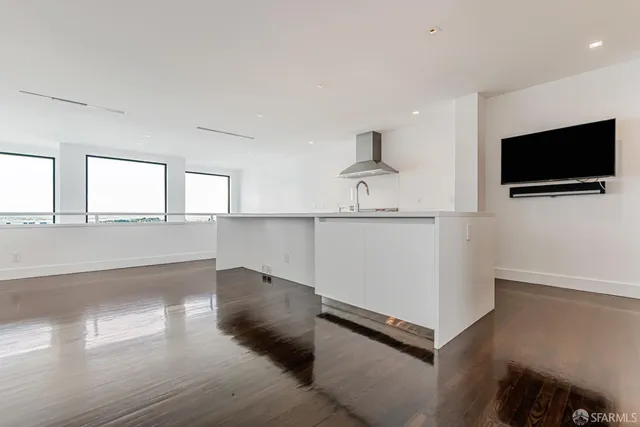 a stove top oven sitting inside of a kitchen