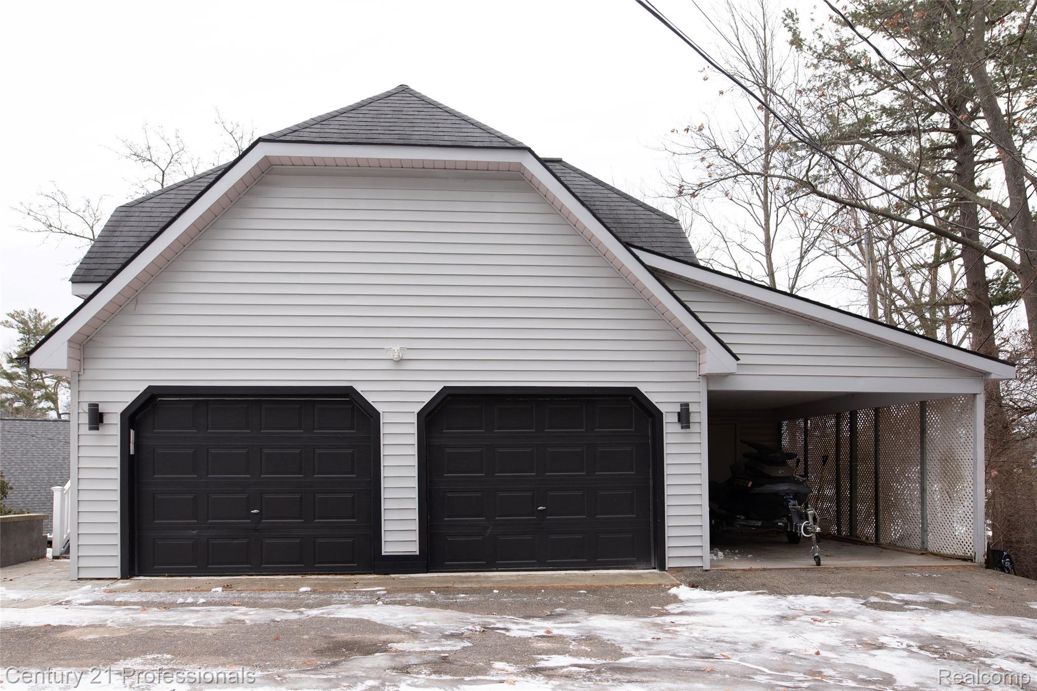 910 West Pine Tree Road West Lake Orion, MI 48362 - Photo 46 of 52 View of snow covered garage