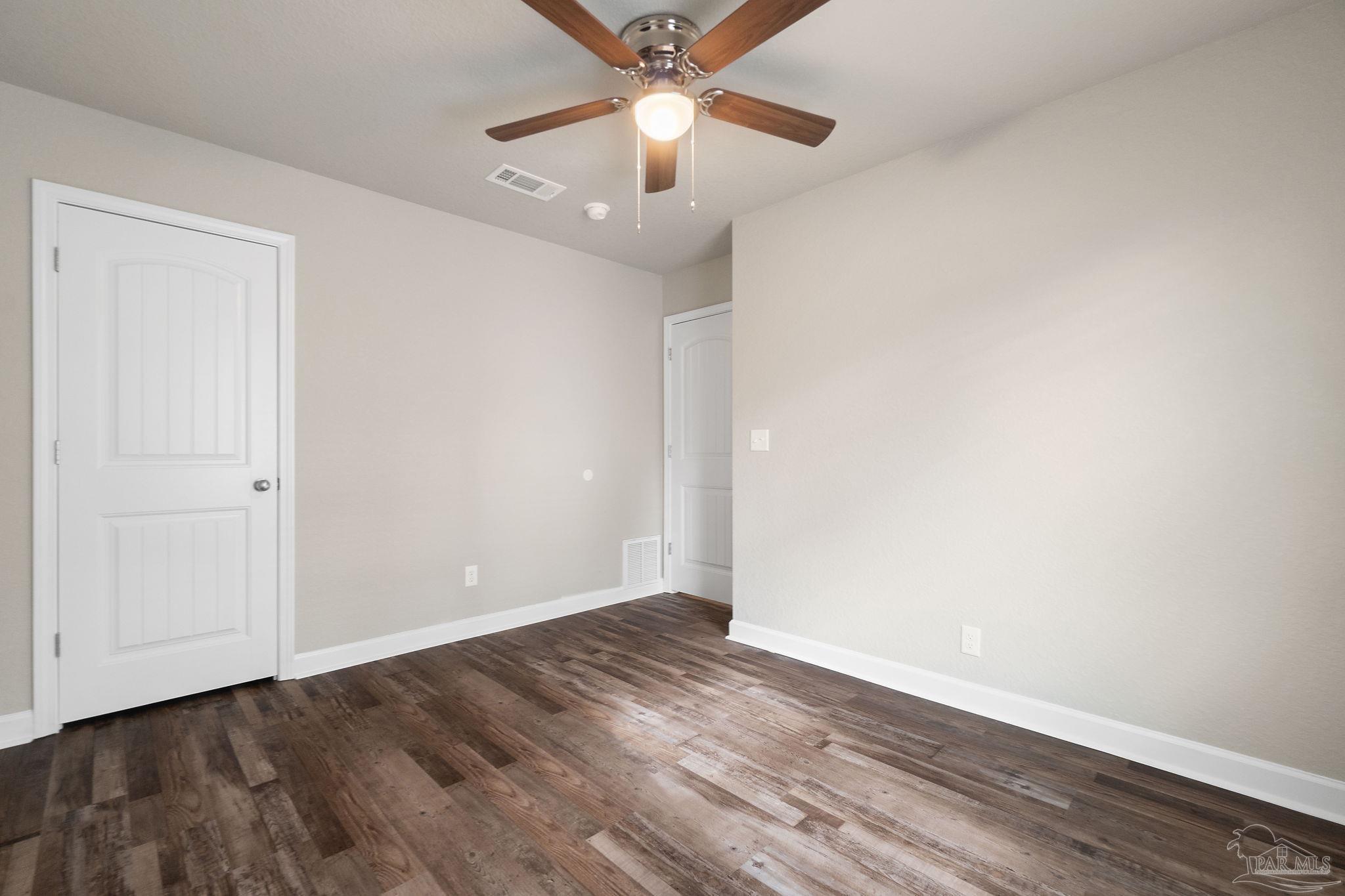 9906 Holsberry Road, Unit 1002 Pensacola, FL 32534 - Photo 13 of 14 wooden floor in an empty room
