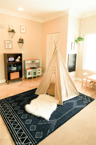 a bed sitting in a room next to a window