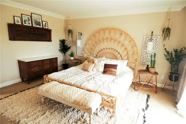 a bedroom with a bed and a television