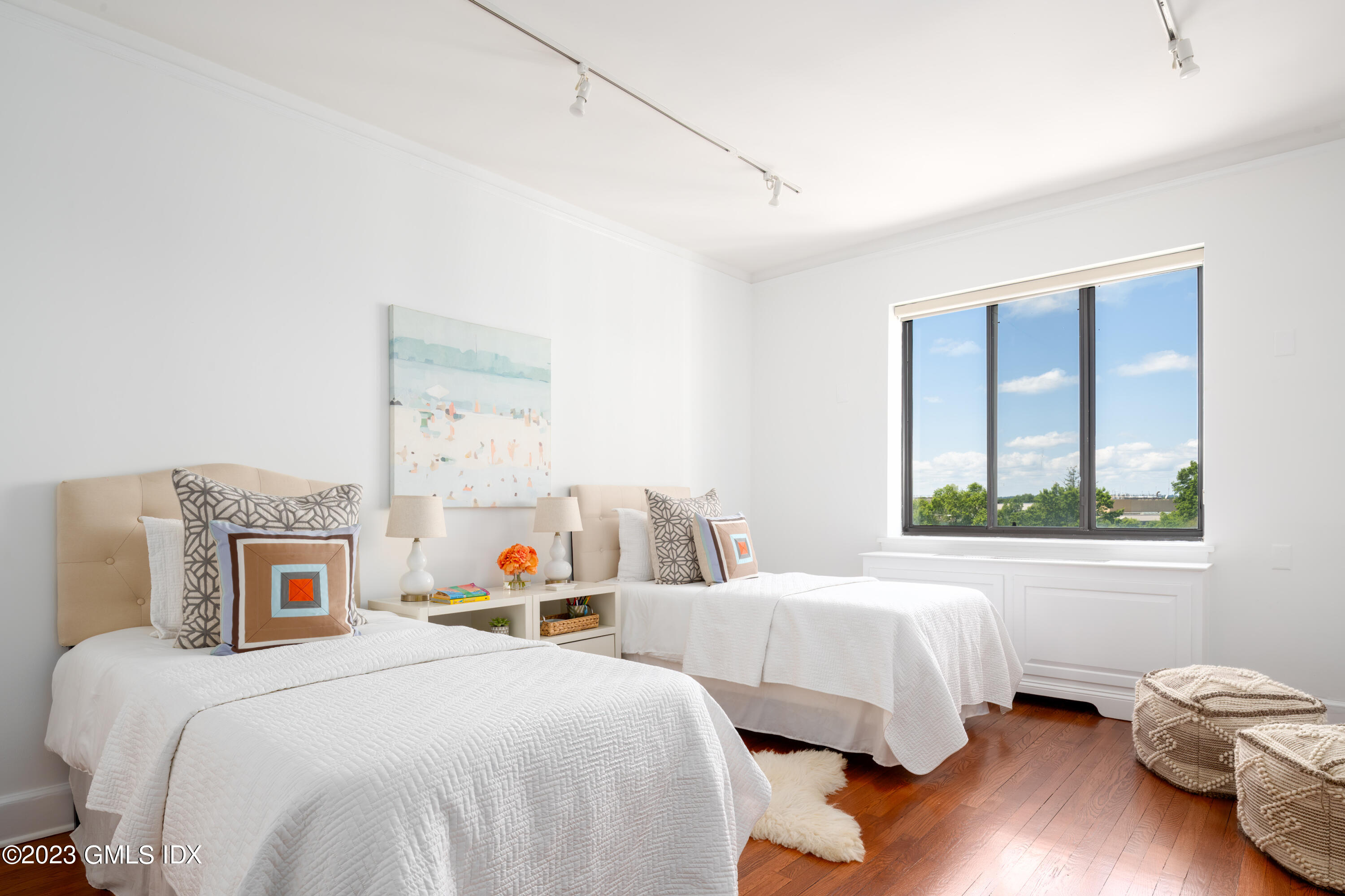 47 Lafayette Place, Unit 5F Greenwich, CT 06830 - Photo 13 of 18 a bedroom with a bed wooden floor and window