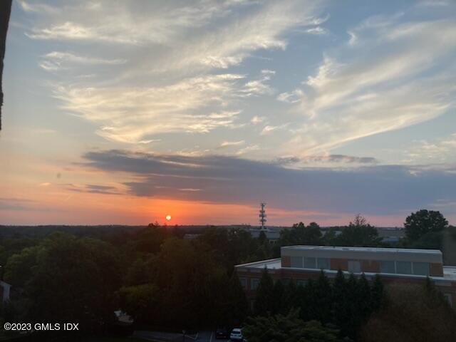 47 Lafayette Place, Unit 5F Greenwich, CT 06830 - Photo 18 of 18 a view of a lake and mountain in the back
