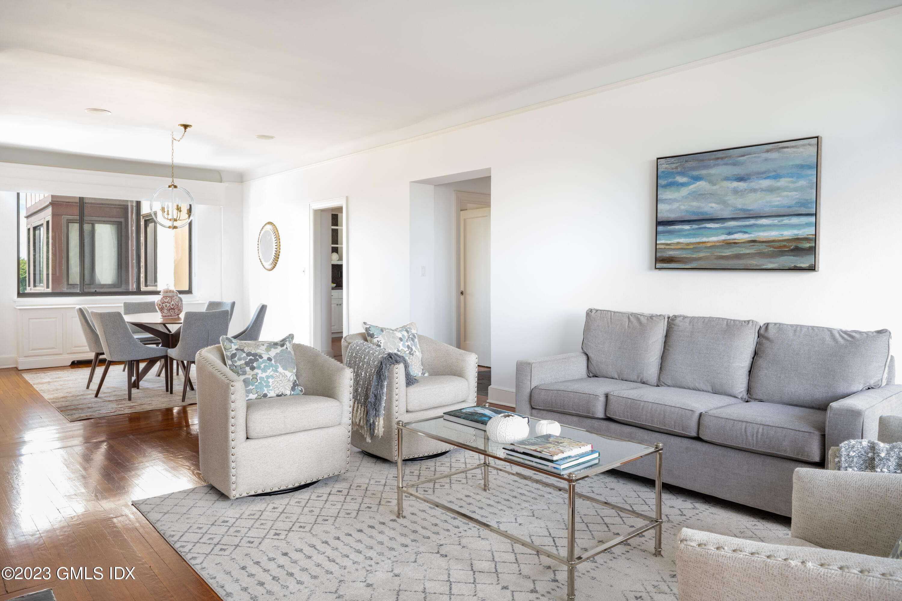 47 Lafayette Place, Unit 5F Greenwich, CT 06830 - Photo 3 of 18 a living room with furniture and wooden floor
