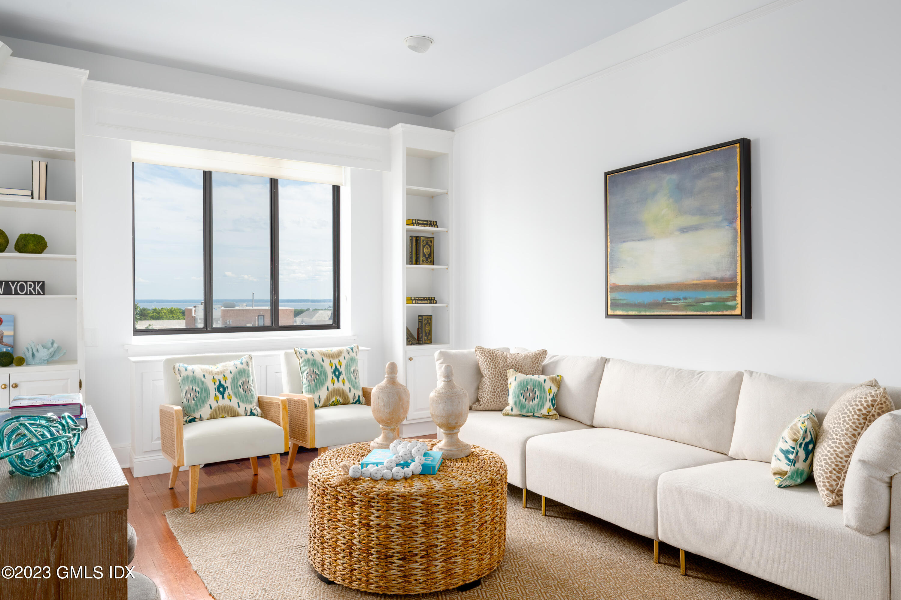 47 Lafayette Place, Unit 5F Greenwich, CT 06830 - Photo 5 of 18 a living room with furniture and a large window