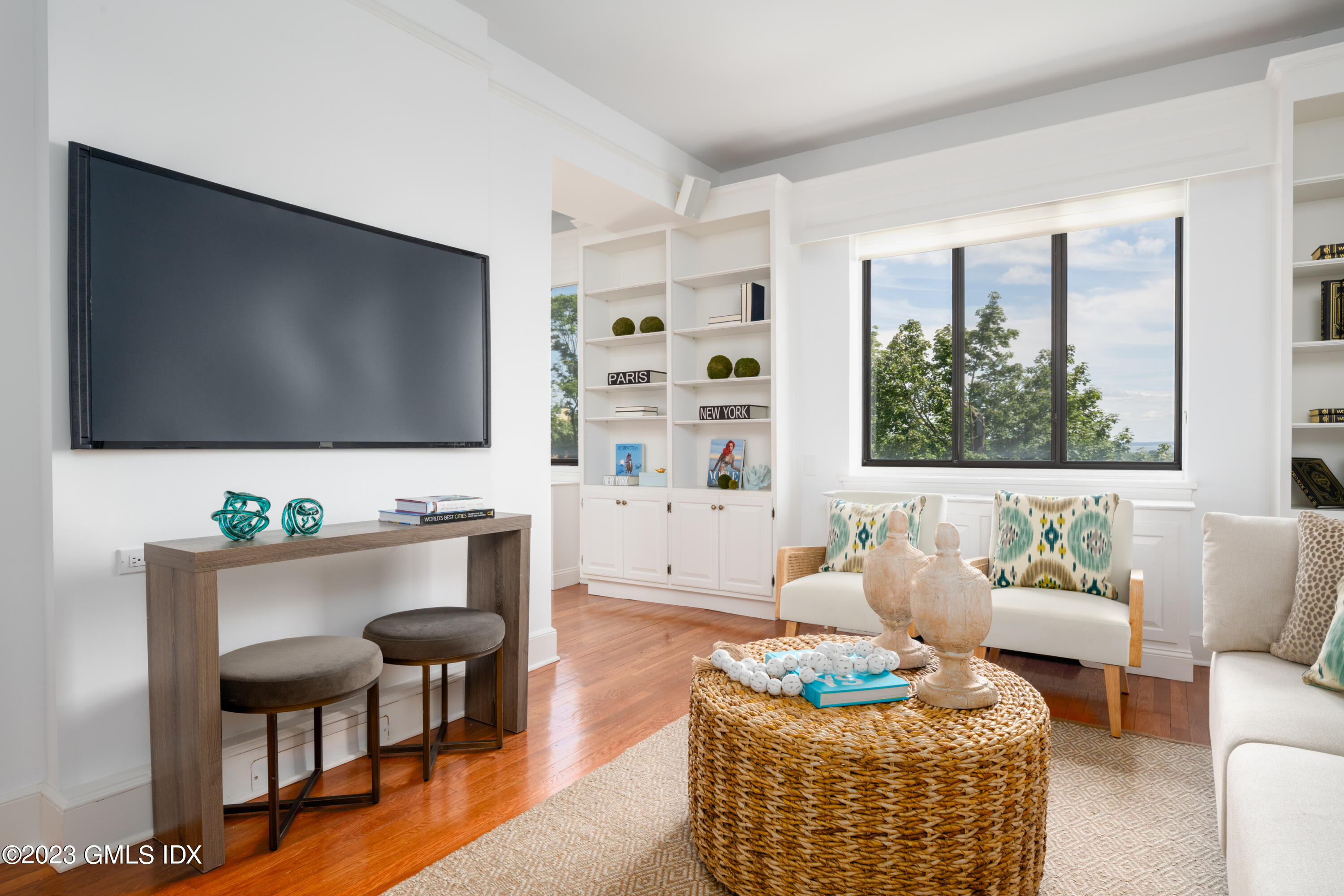 47 Lafayette Place, Unit 5F Greenwich, CT 06830 - Photo 6 of 18 a living room with furniture and a flat screen tv