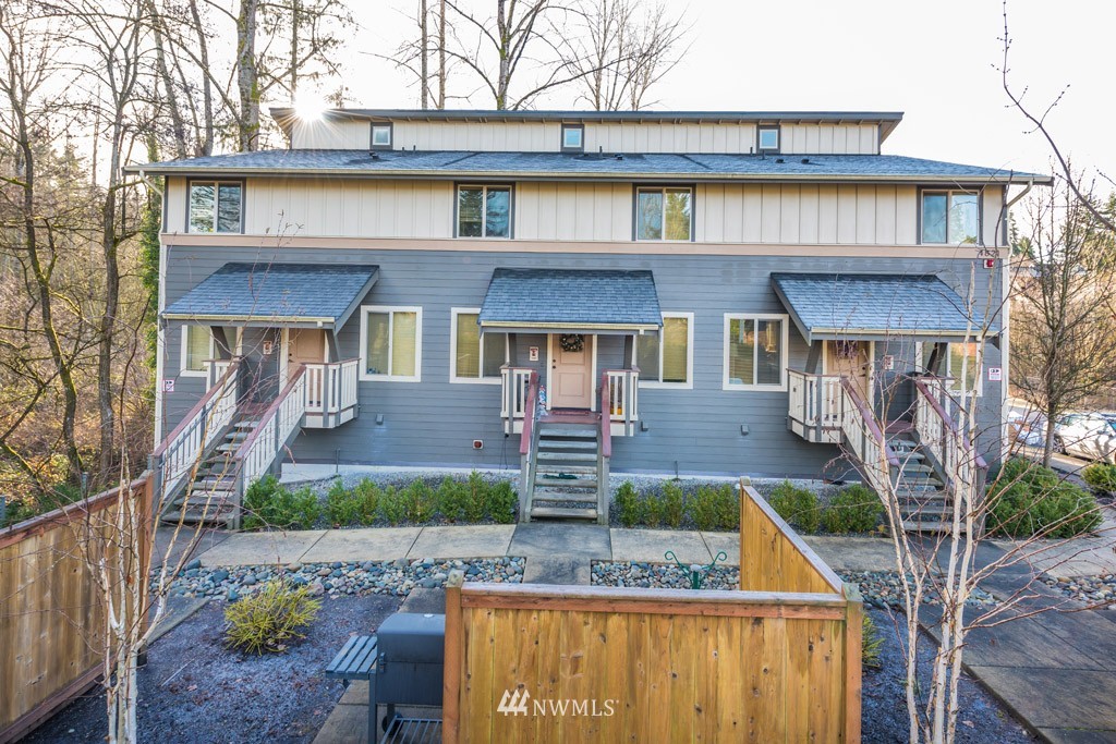 4821 Northeast Sunset Boulevard Renton, WA 98059 - Photo 3 of 12 a front view of a house with garden