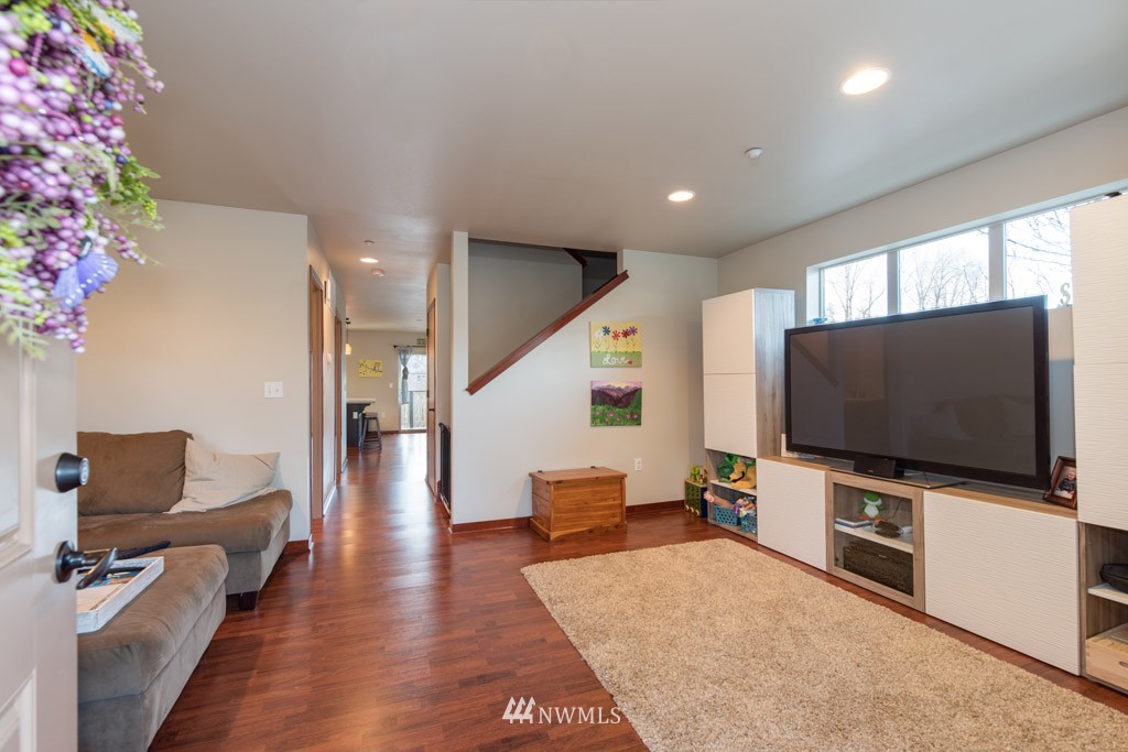 4821 Northeast Sunset Boulevard Renton, WA 98059 - Photo 5 of 12 a living room with furniture and a flat screen tv