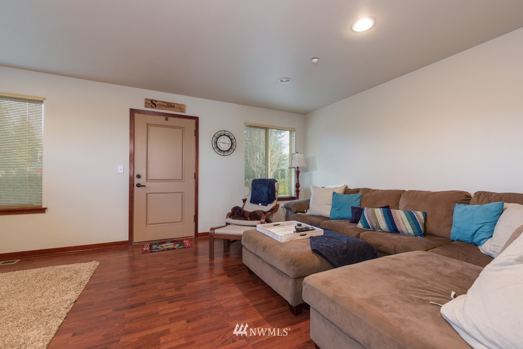 4821 Northeast Sunset Boulevard Renton, WA 98059 - Photo 6 of 12 a living room with furniture and wooden floor