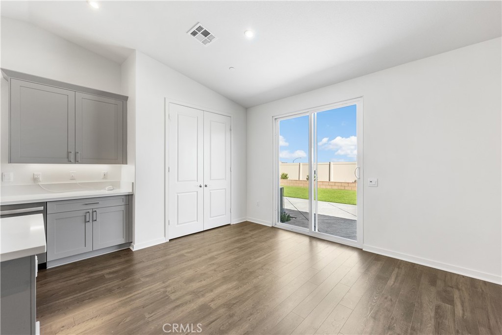 41846 Castello Lane Palmdale, CA 93552 - Photo 25 of 46 a view of an empty room with window and wooden floor