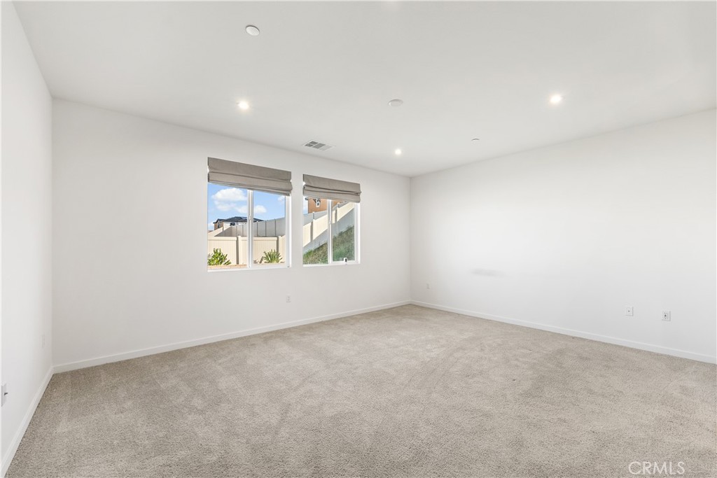 41846 Castello Lane Palmdale, CA 93552 - Photo 29 of 46 an empty room with windows