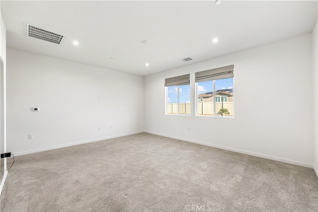 41846 Castello Lane Palmdale, CA 93552 - Photo 32 of 46 an empty room with windows