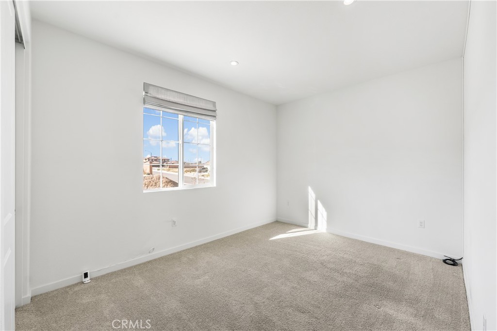 41846 Castello Lane Palmdale, CA 93552 - Photo 40 of 46 an empty room with a window