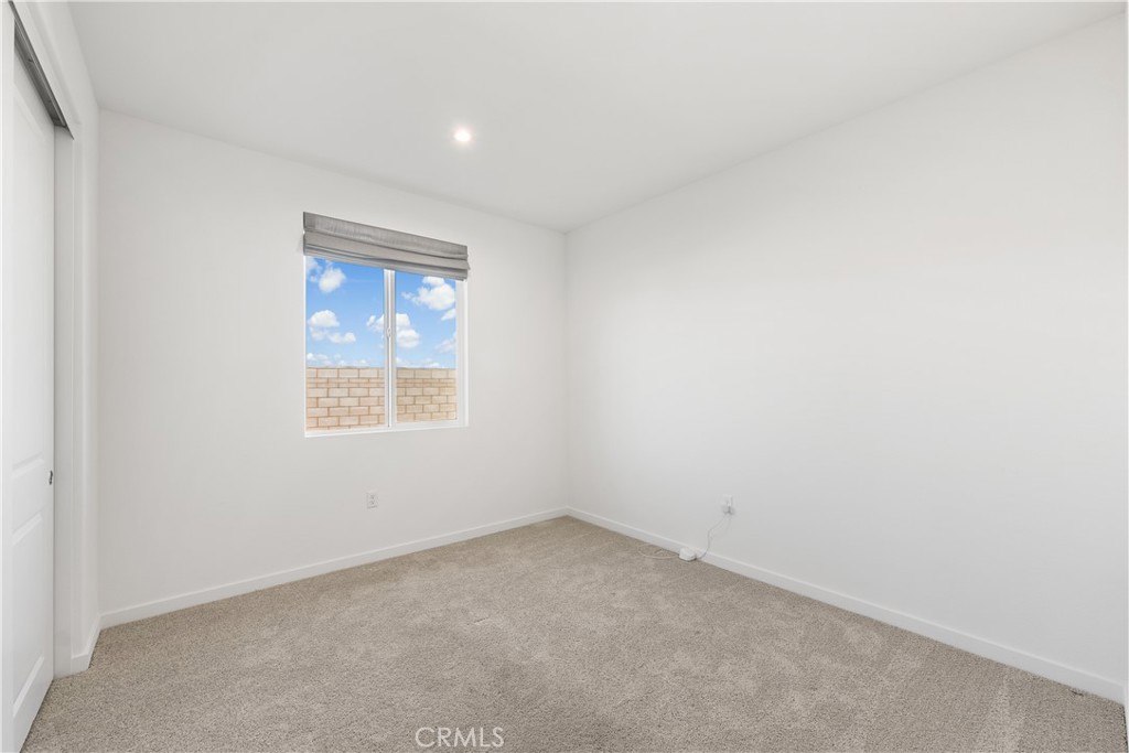 41846 Castello Lane Palmdale, CA 93552 - Photo 42 of 46 an empty room with a window