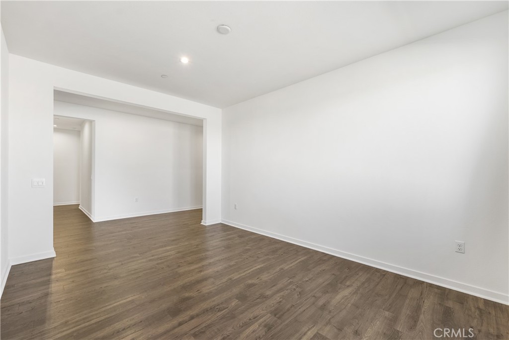 41846 Castello Lane Palmdale, CA 93552 - Photo 7 of 46 a view of an empty room with wooden floor