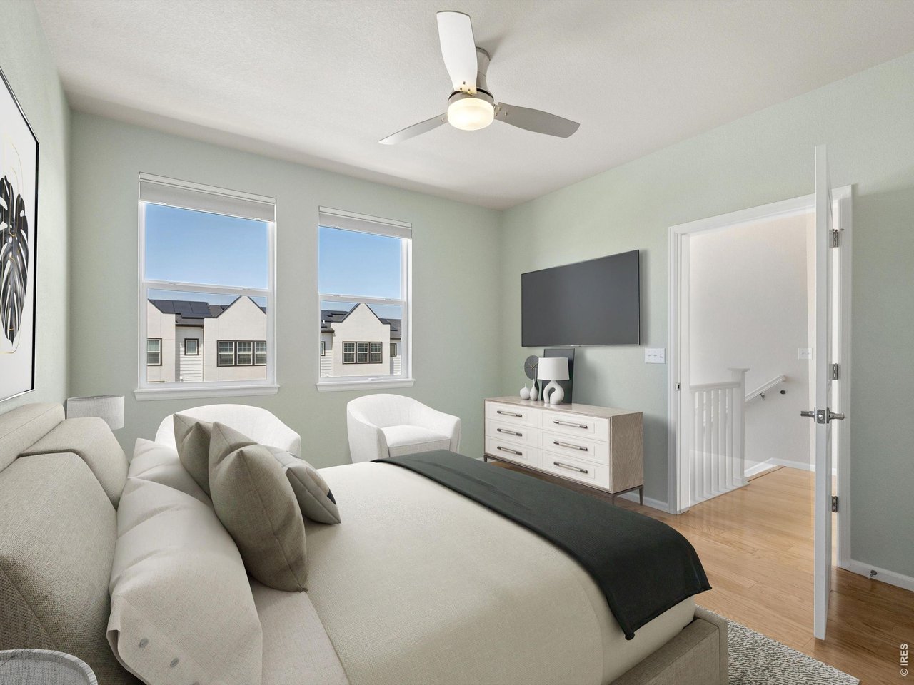 11202 Colony Circle Broomfield, CO 80021 - Photo 12 of 23 a bedroom with furniture and a flat screen tv