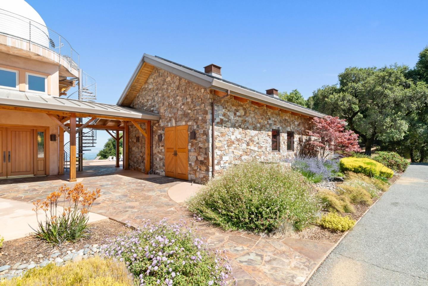 15060 Montebello Road Cupertino, CA 95014 - Photo 60 of 82 a front view of a house with a yard