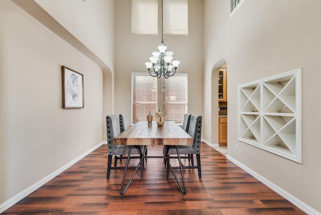 5404 Worley Drive The Colony, TX 75056 - Photo 11 of 30 a view of a dining room with furniture window and wooden floor