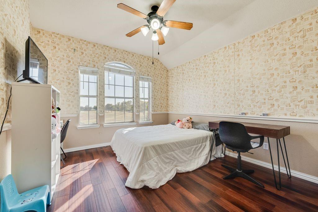 5404 Worley Drive The Colony, TX 75056 - Photo 18 of 30 a bedroom with a bed dresser and a window