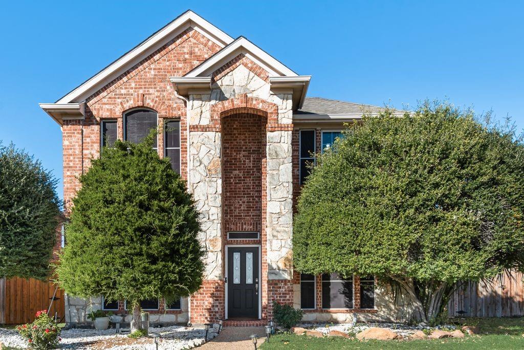 5404 Worley Drive The Colony, TX 75056 - Photo 2 of 30 a front view of a house with a yard
