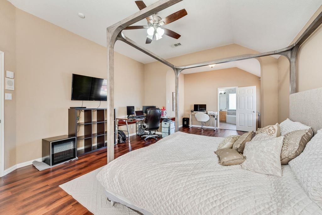 5404 Worley Drive The Colony, TX 75056 - Photo 21 of 30 a bed room with a bed and a television