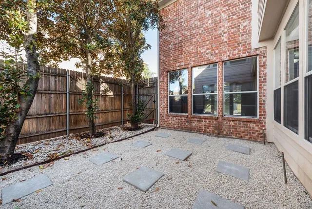 a bathroom with a tub sink double vanity and mirror