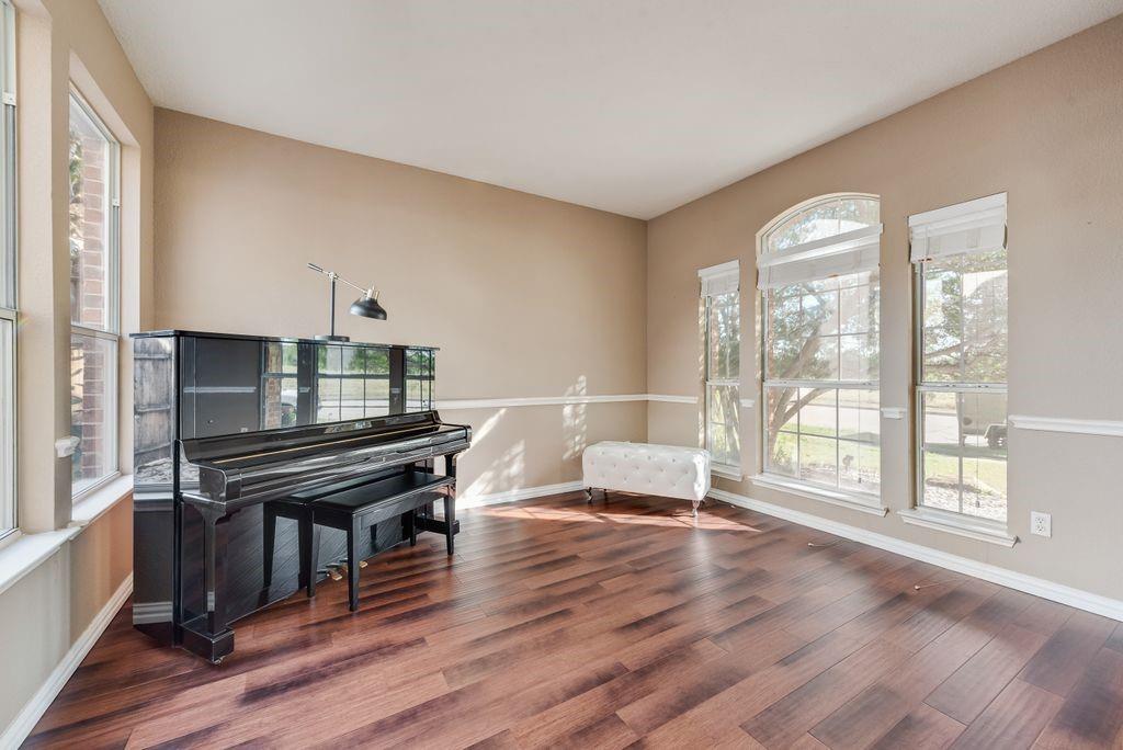 5404 Worley Drive The Colony, TX 75056 - Photo 5 of 30 a living room with furniture a wooden floor and a large window
