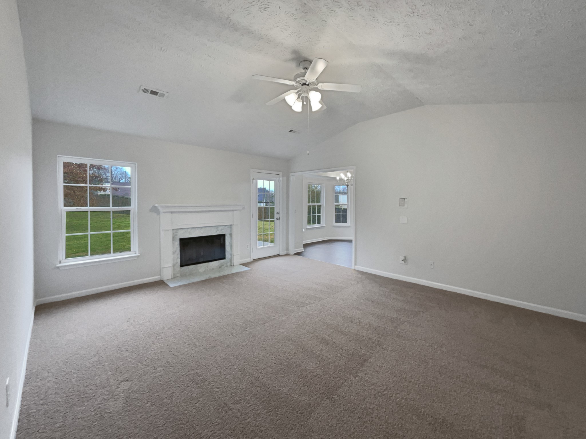 760 Autumn Ridge Lane Columbia, TN 38401 - Photo 2 of 19 an empty room with windows and fireplace