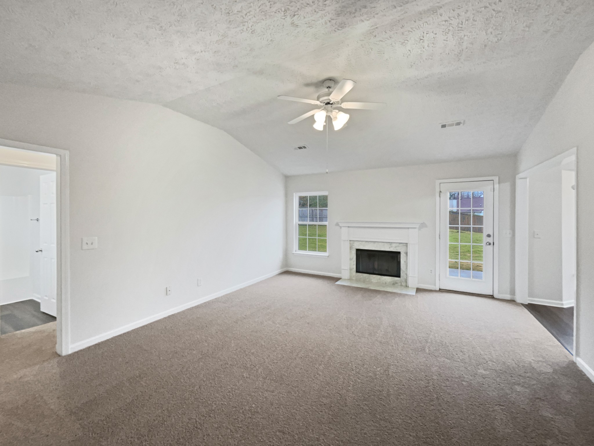 760 Autumn Ridge Lane Columbia, TN 38401 - Photo 3 of 19 a view of empty room with a fireplace and ceiling fan