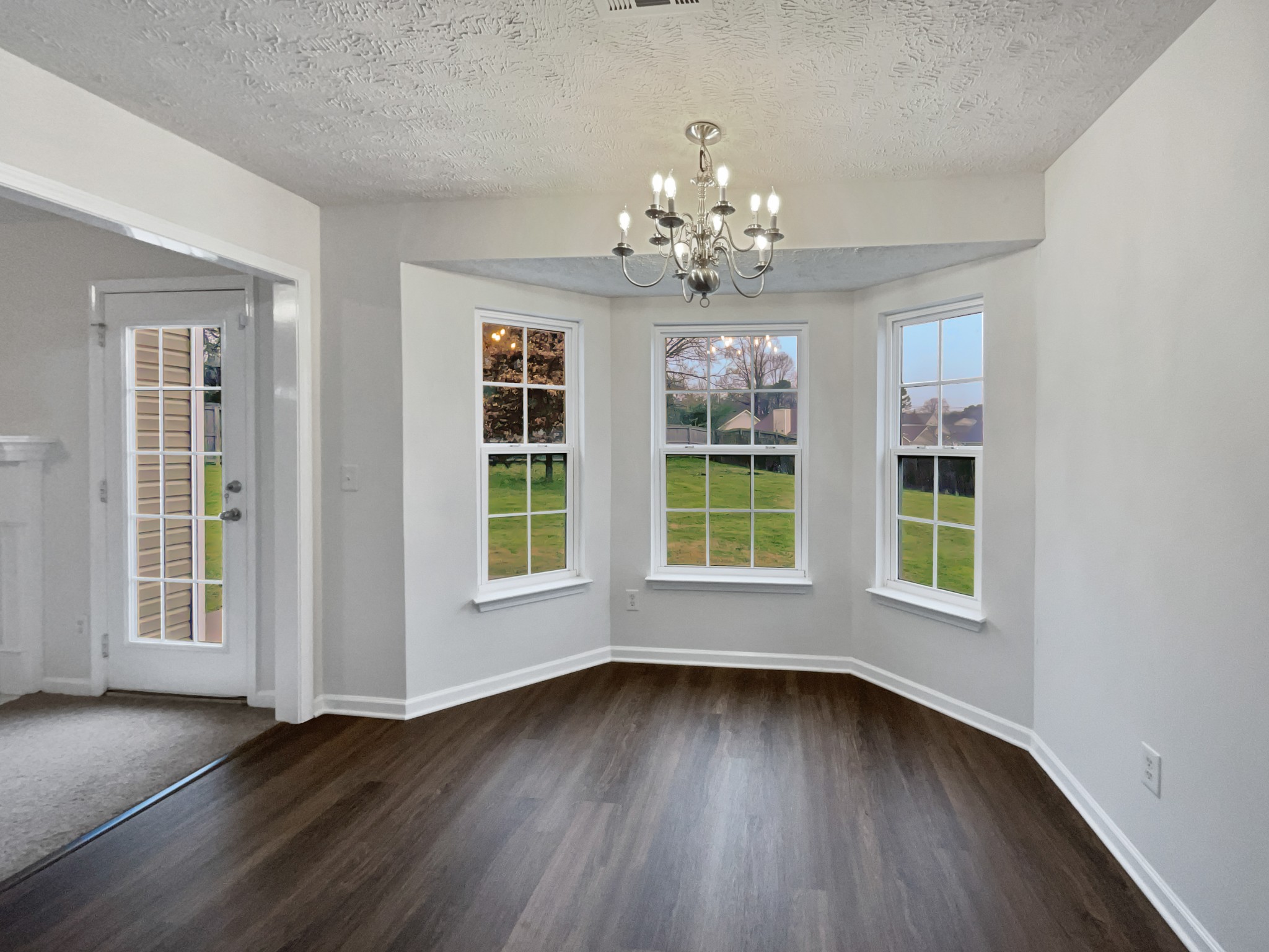 760 Autumn Ridge Lane Columbia, TN 38401 - Photo 7 of 19 a view of an empty room with wooden floor and a window