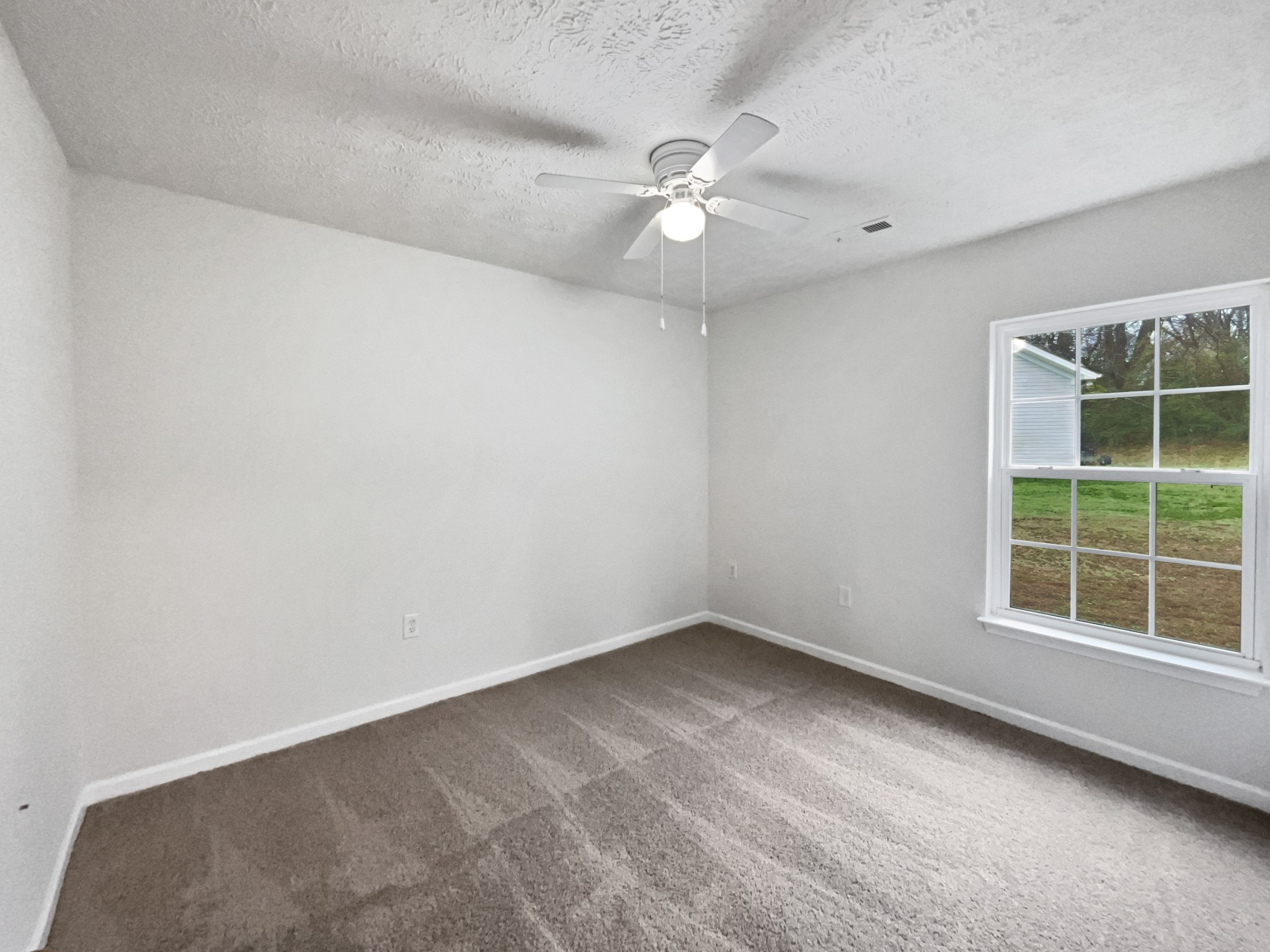 760 Autumn Ridge Lane Columbia, TN 38401 - Photo 9 of 19 an empty room with a window and a fan