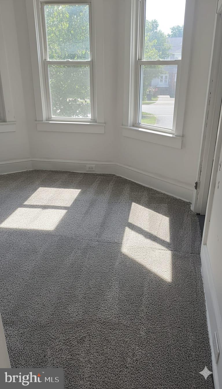 24 West Hancock Street Riverside, NJ 08075 - Photo 2 of 9 an empty room with a window