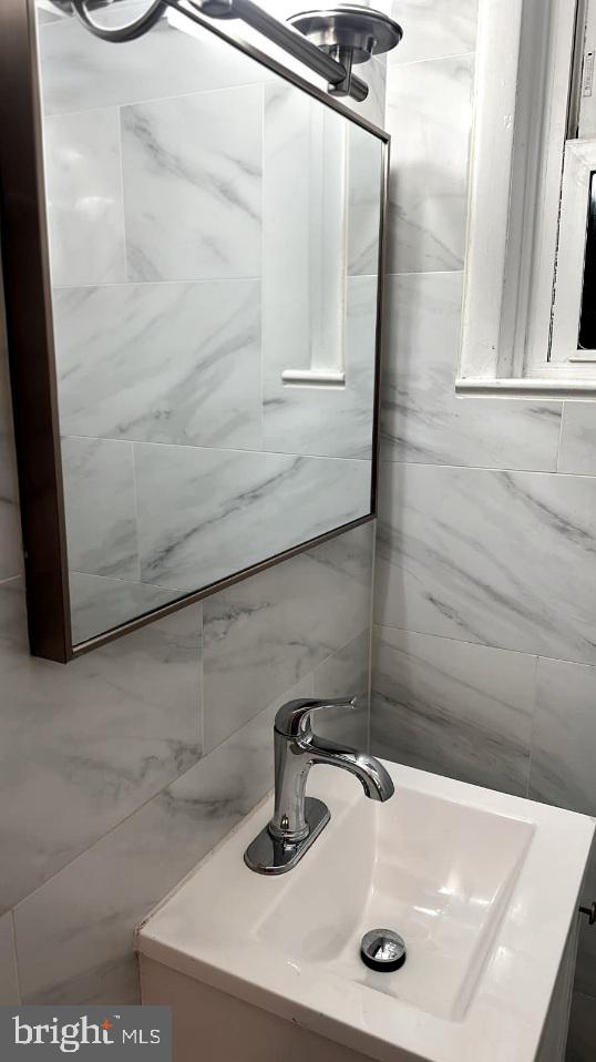 24 West Hancock Street Riverside, NJ 08075 - Photo 3 of 9 a bathroom with a sink and a mirror