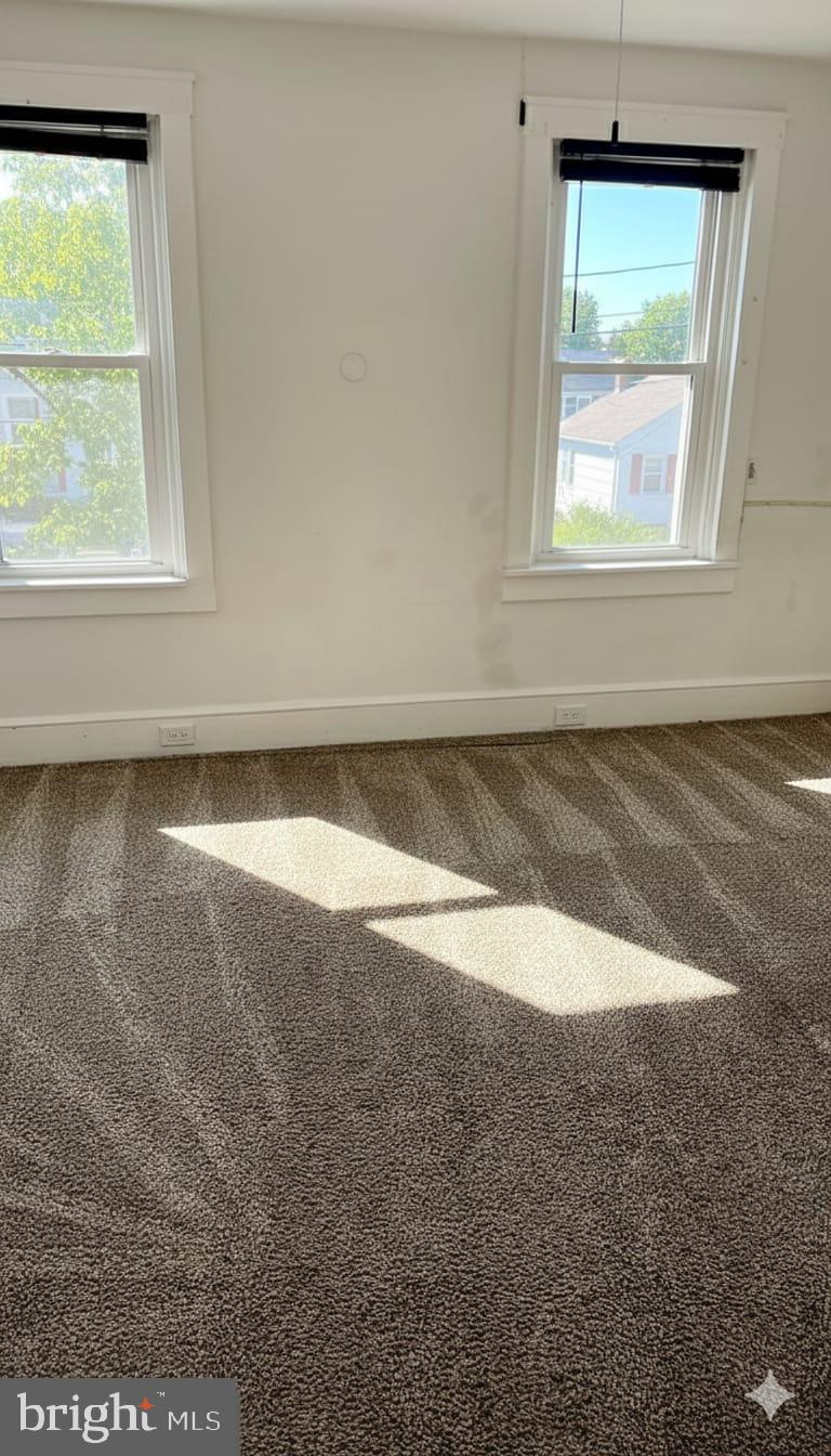 24 West Hancock Street Riverside, NJ 08075 - Photo 5 of 9 an empty room with a window