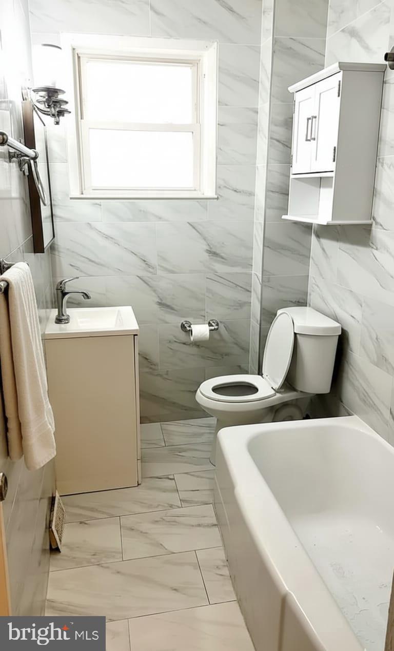 24 West Hancock Street Riverside, NJ 08075 - Photo 6 of 9 a living room with furniture and a window