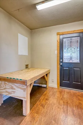 a room with pool table and window