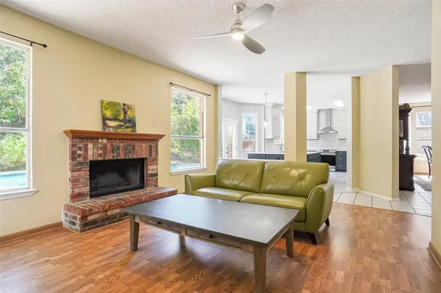 a living room with furniture and a fireplace