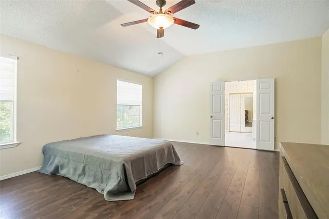 a bedroom with a bed and window