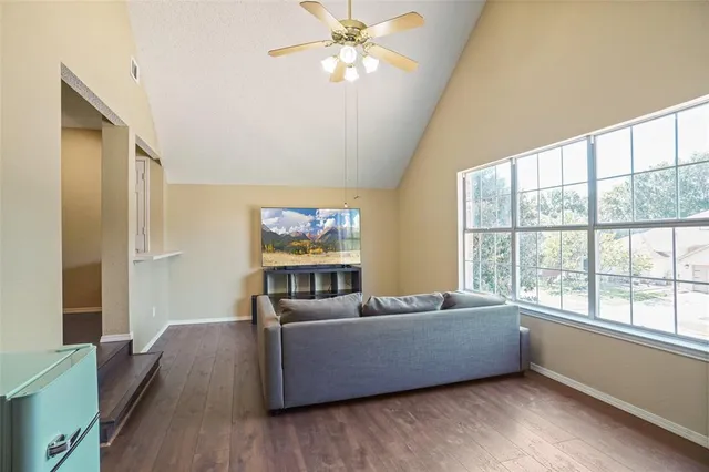 a living room with furniture and a large window