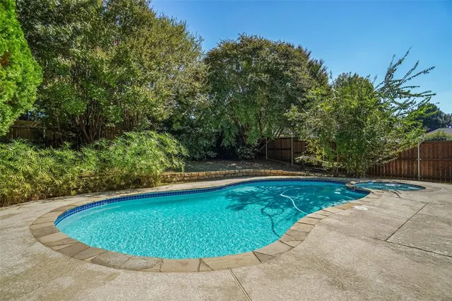 a view of a swimming pool with an outdoor space