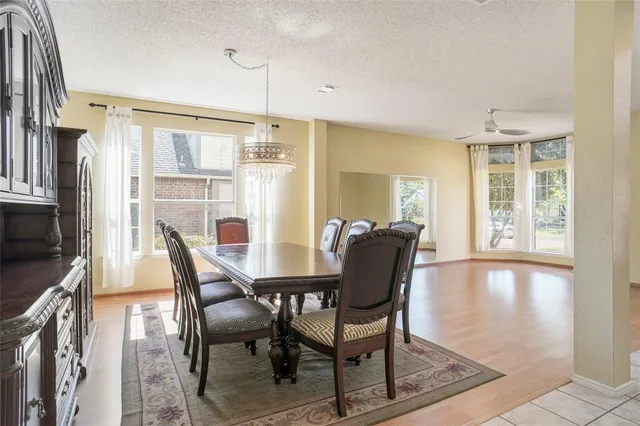 a view of a dining room with furniture and a window