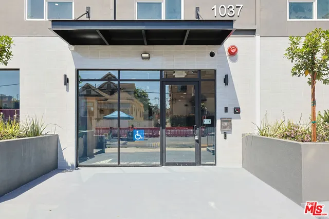 a kitchen with sink a stove and cabinets