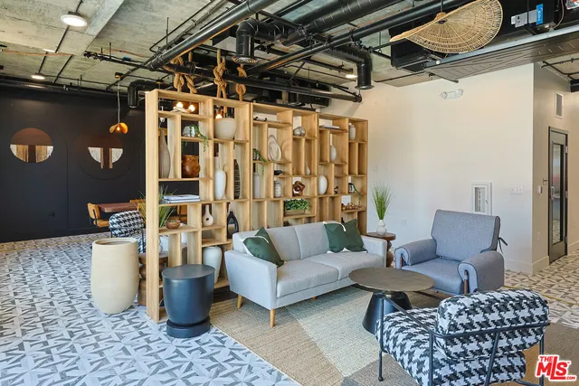 a kitchen with stainless steel appliances granite countertop a sink a stove and refrigerator