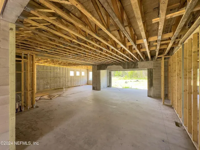 a view of a room with wooden walls