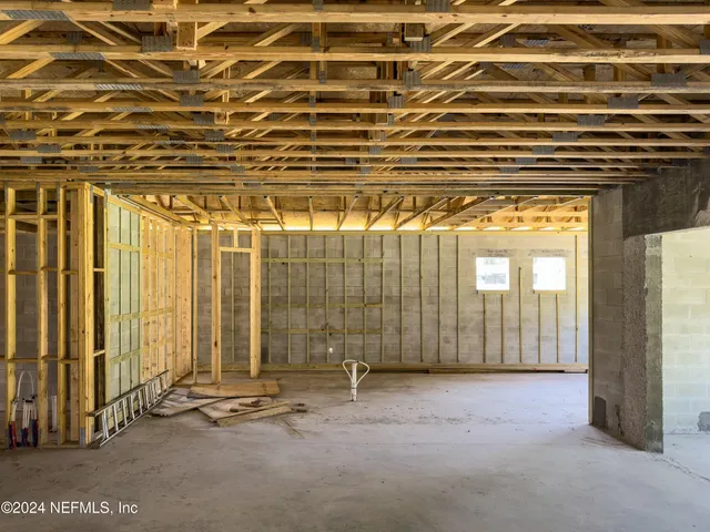 a view of an empty room with windows