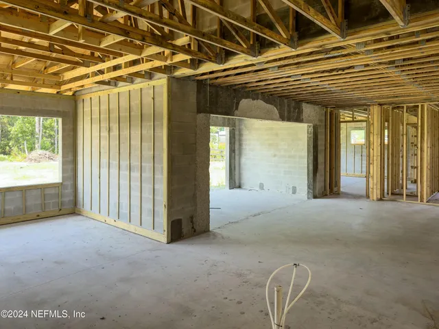 a swimming pool with outdoor seating and yard