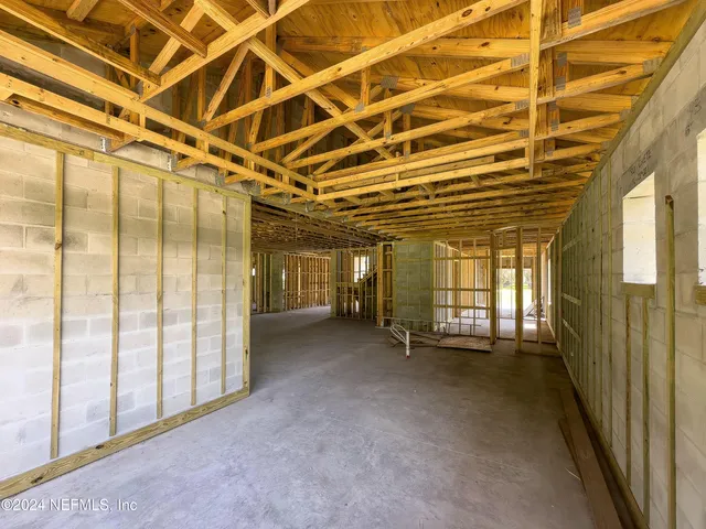 a view of a house with a yard and garage