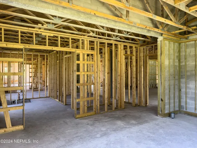 a view of a room with wooden walls