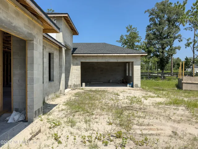 a view of a house with a yard and garage