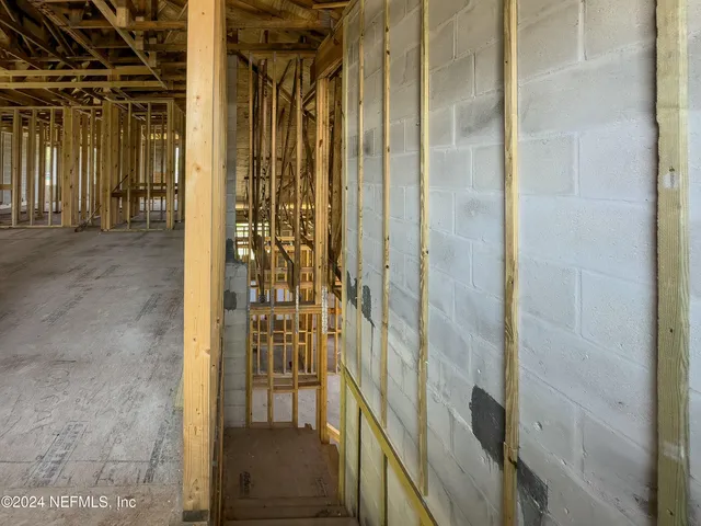 a balcony with furniture and a garden